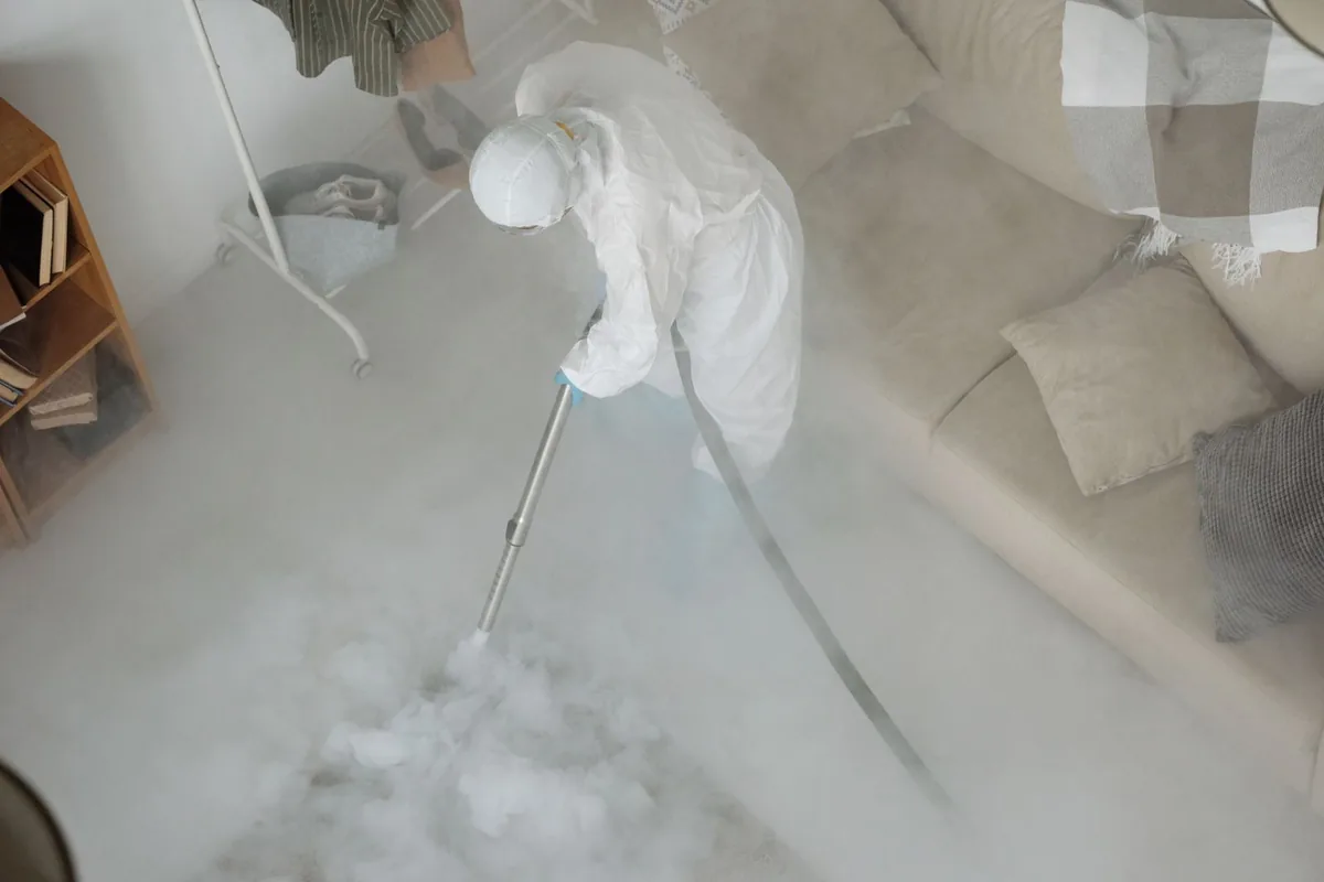 Biohazard cleanup technician in protective equipment, Natchez, MS